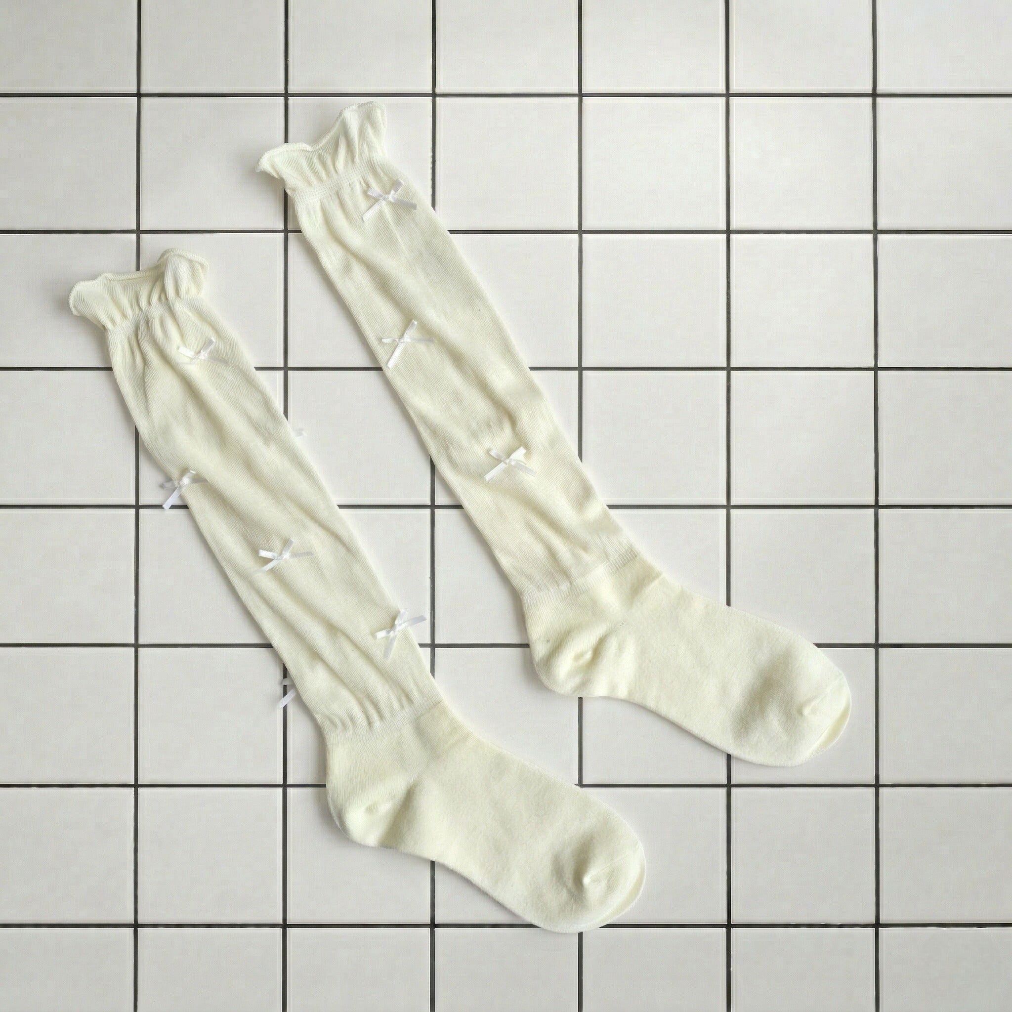 108. Long Creme Polly with Baby Bows